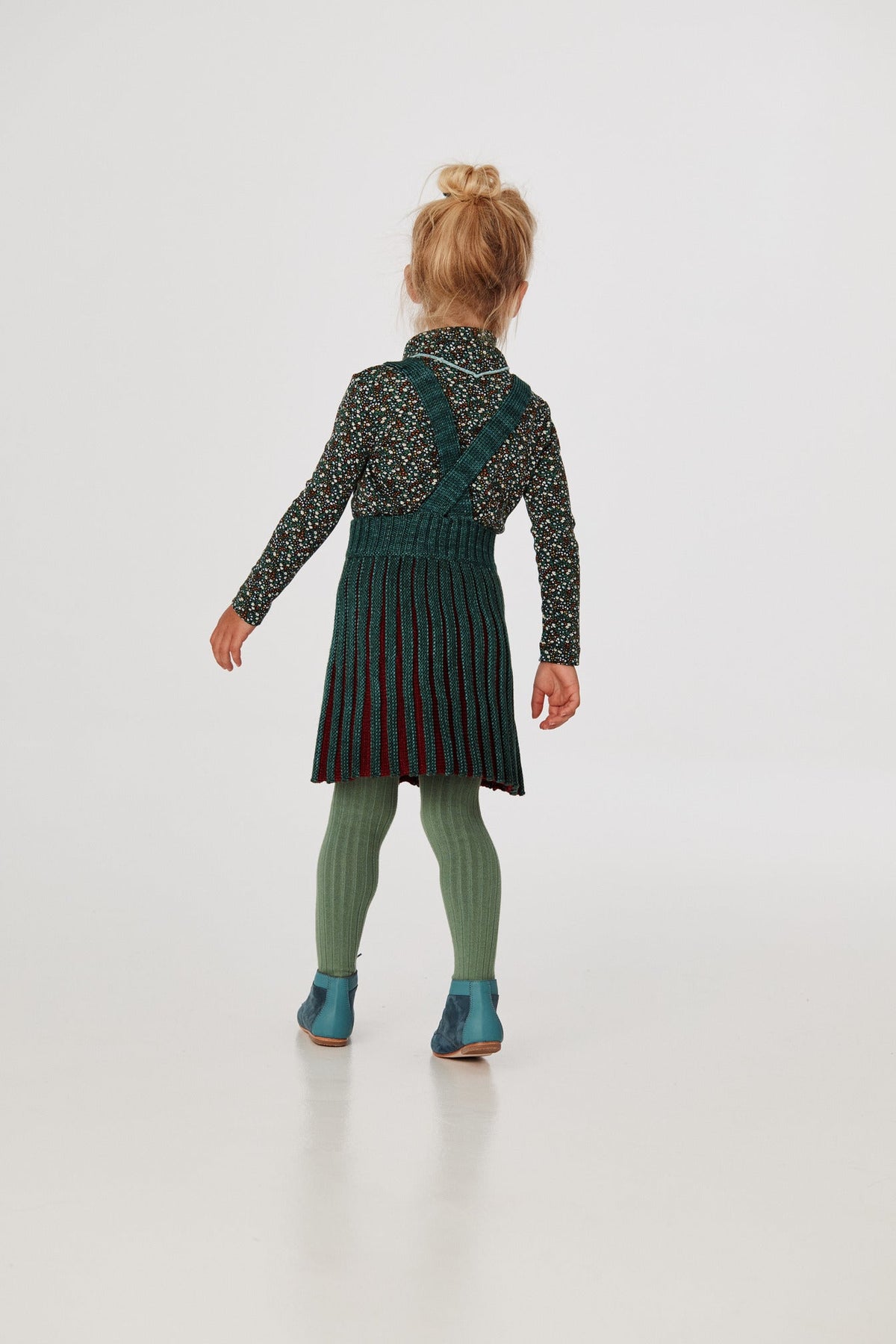 Accordion Pleat Pinafore - Peacock+Model is 41 inches tall, 38lbs, wearing a size 4-5y