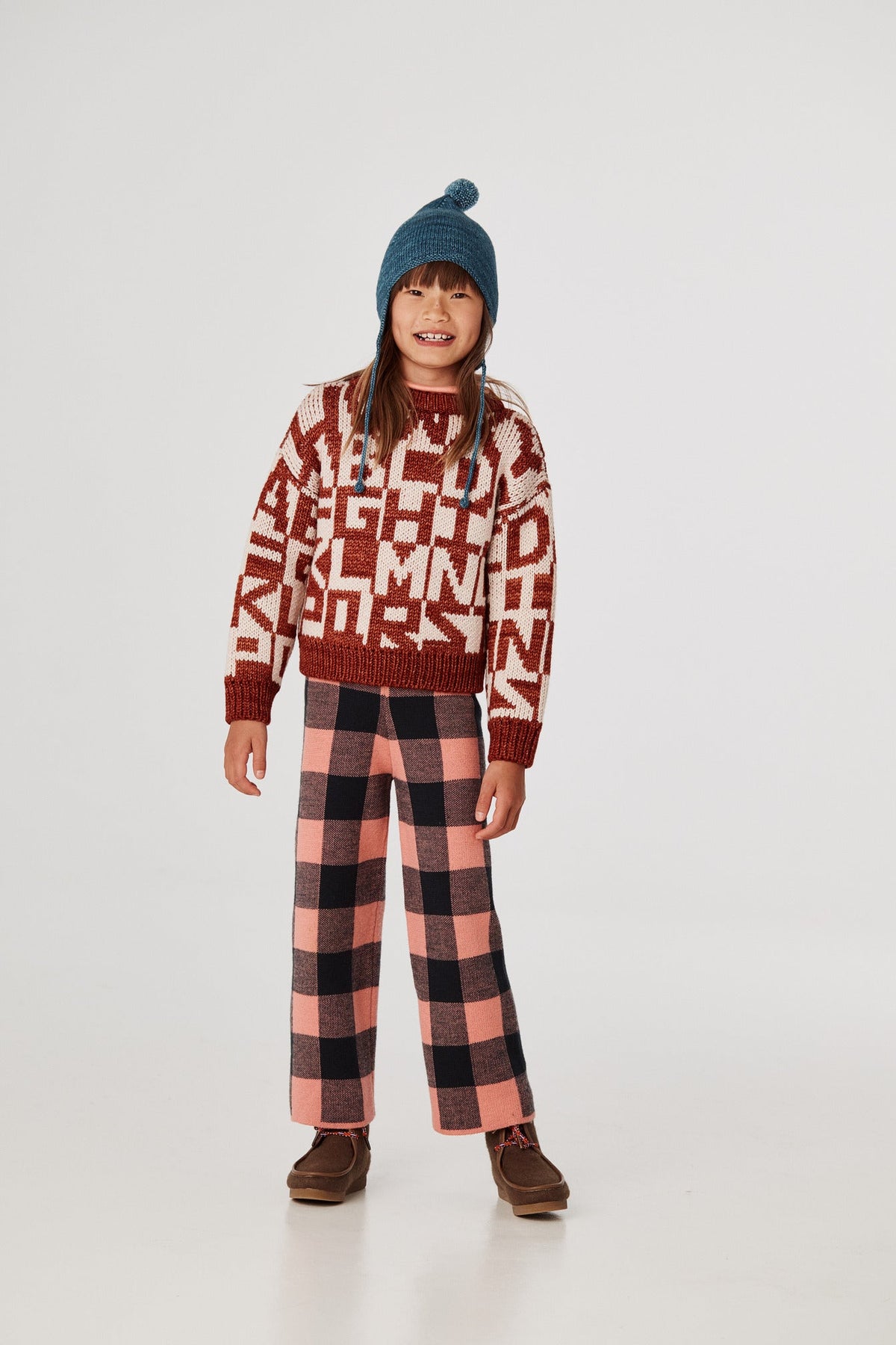 Alphabet Intarsia Sweater - Henna+Model is 48 inches tall, 51lbs, wearing a size 7-8y