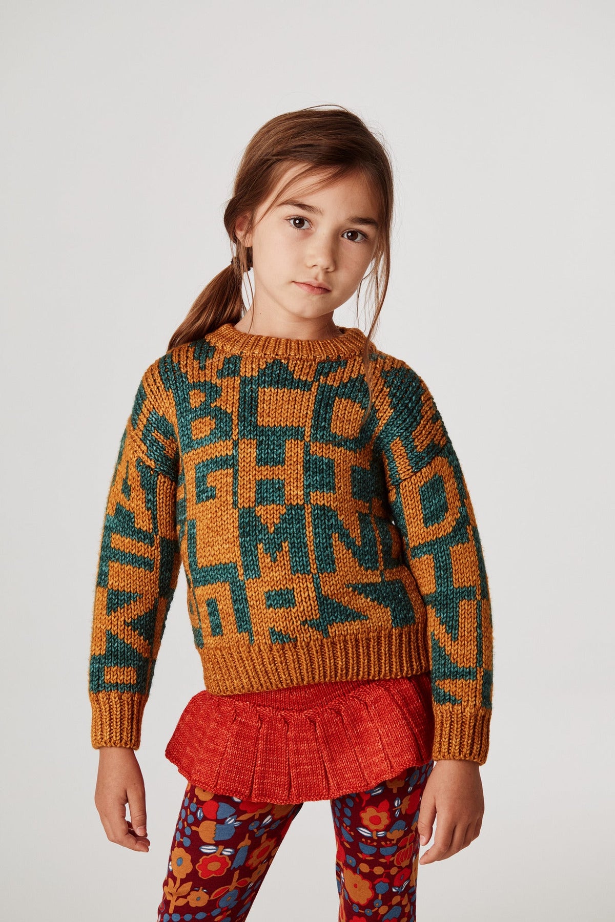 Alphabet Intarsia Sweater - Marigold+Model is 48 inches tall, 44lbs, wearing a size 4-5y