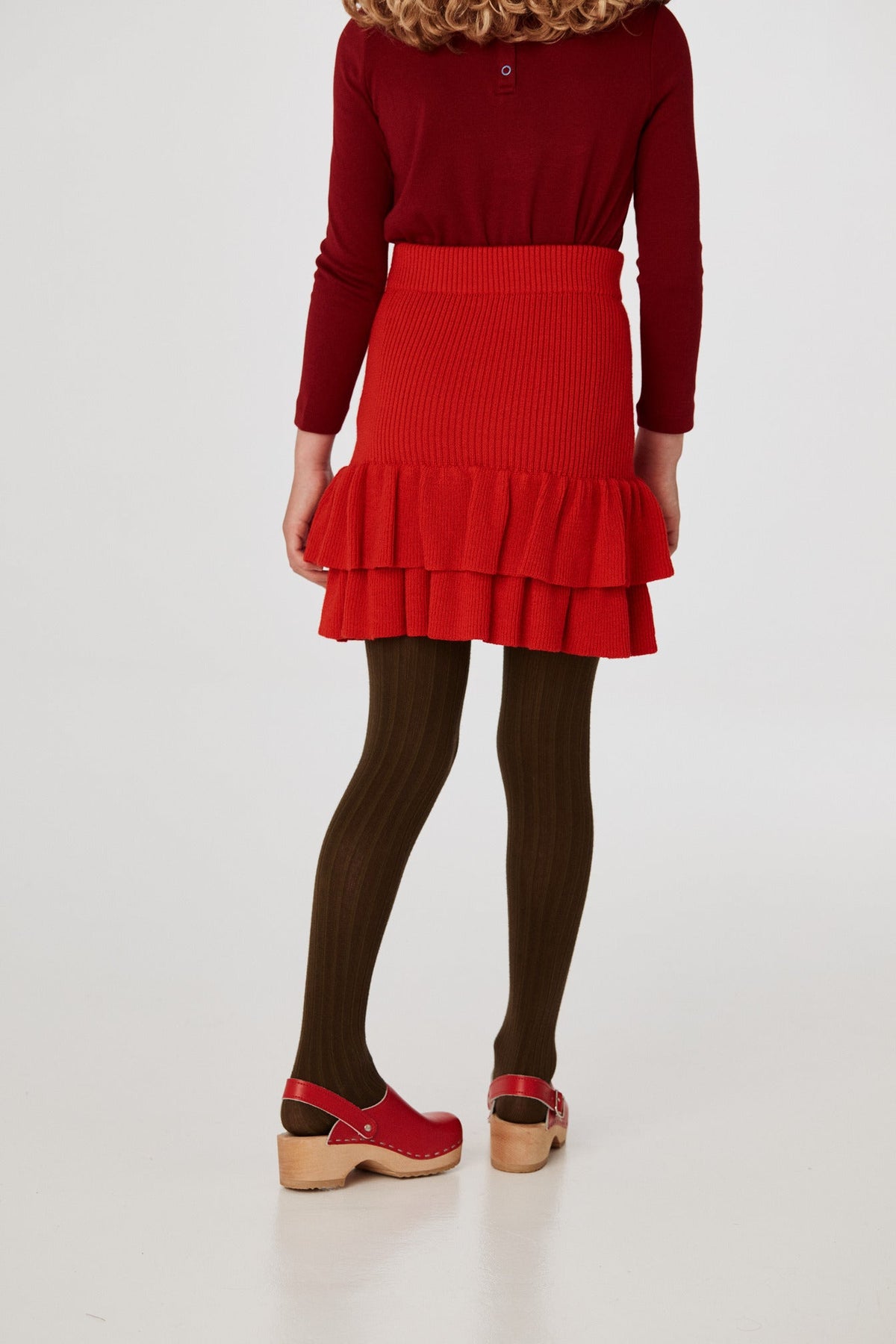 Block Party Skirt - Red Flame+Model is 53 inches tall, 58lbs, wearing a size 7-8y