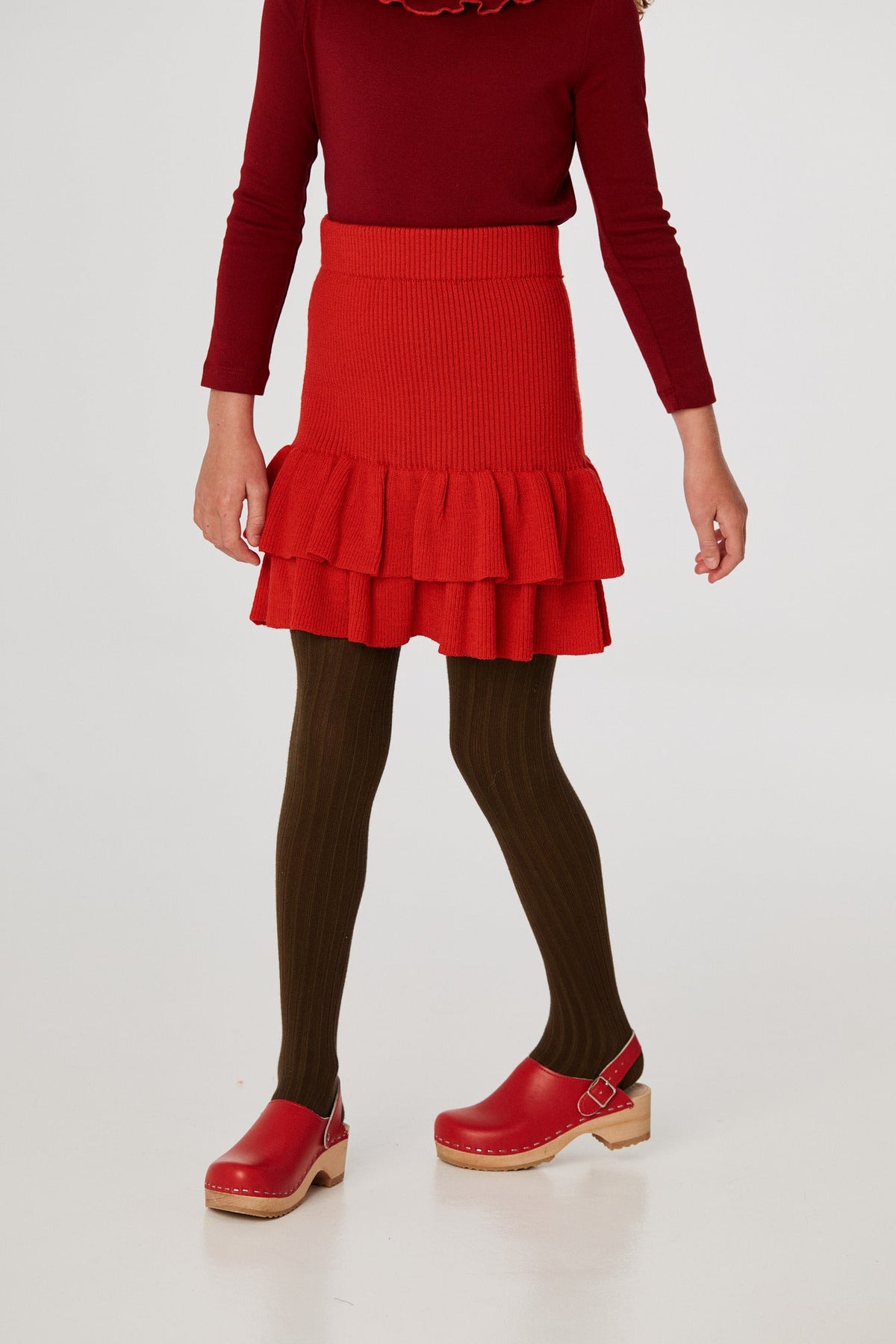 Block Party Skirt - Red Flame+Model is 53 inches tall, 58lbs, wearing a size 7-8y