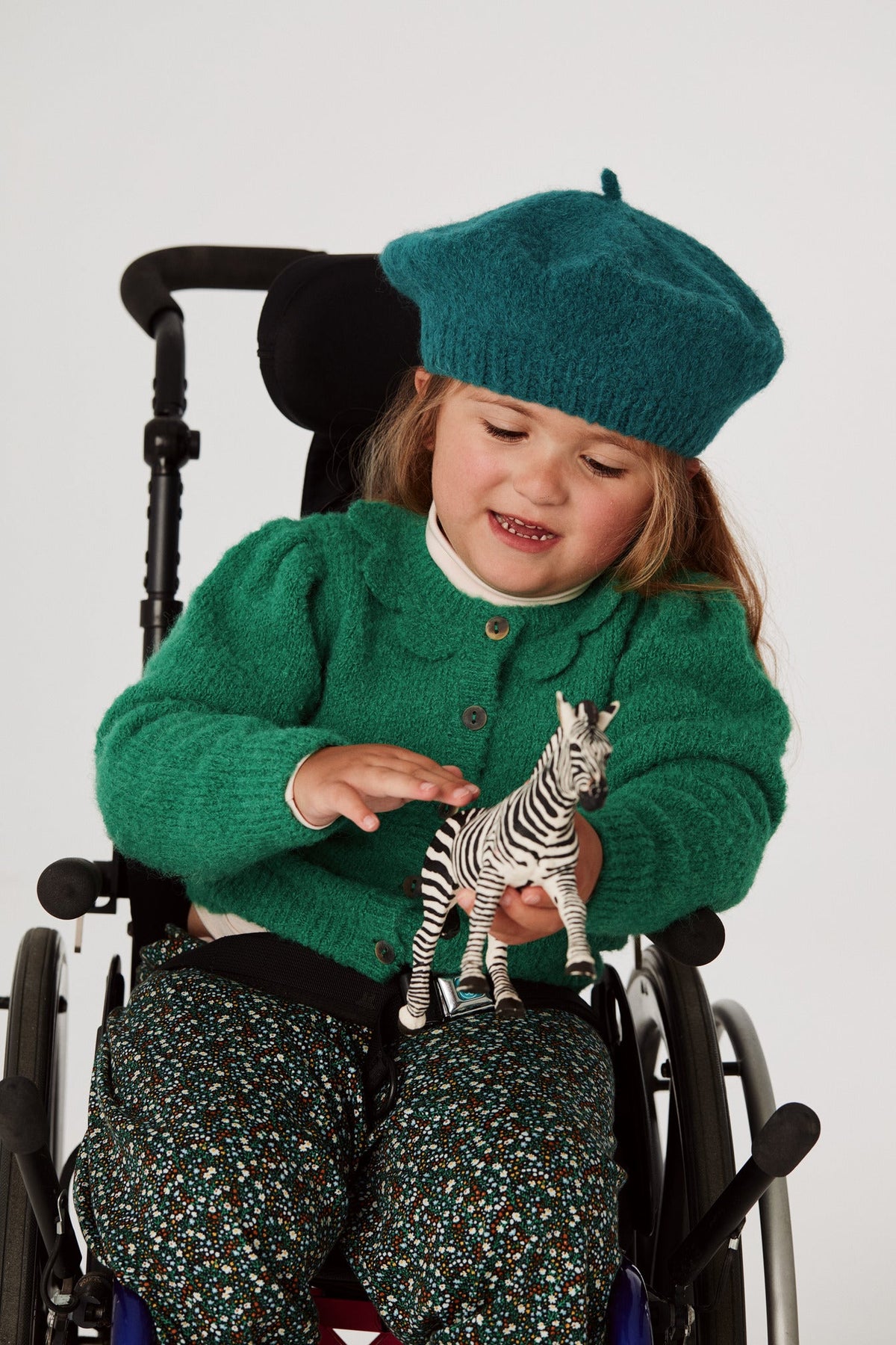 Boucle Flower Ellie Cardigan - Emerald+Model is 42 inches tall, 57lbs, wearing a size 6-7y