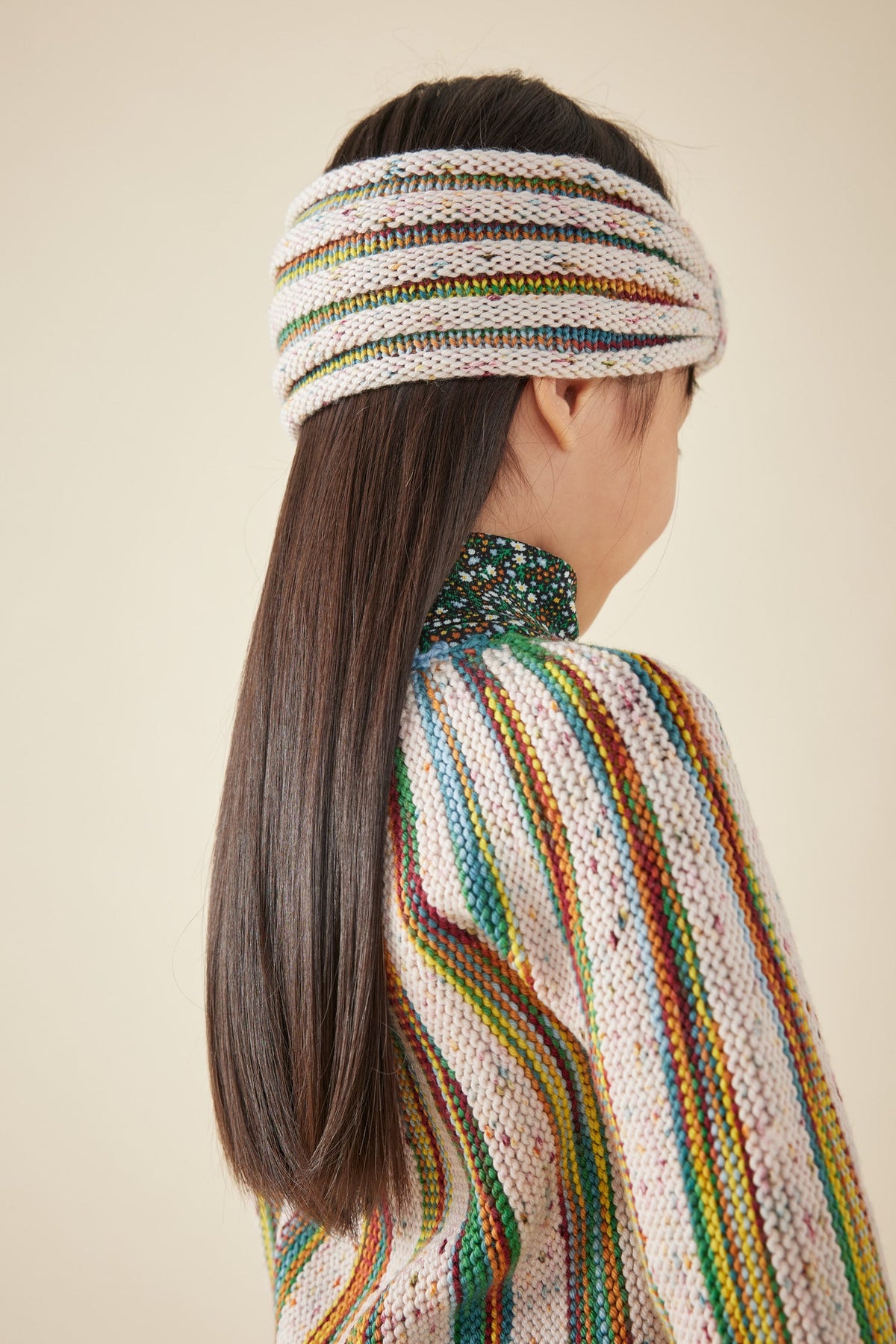 Accordion Pleat Headband - Carnival Space Dye+Model is 43 inches tall, 38lbs, wearing a size Small/Medium