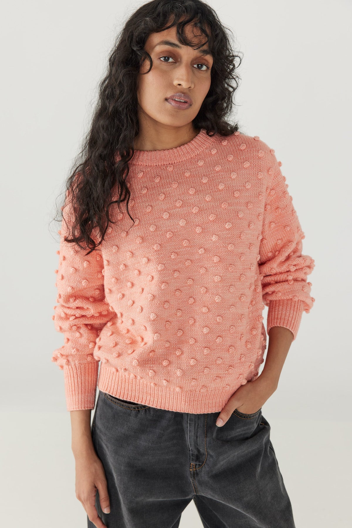 Adult Popcorn Crew Sweater - Grapefruit+Model is 5&#39;9&quot; | 31&quot; Bust | 24&quot; Waist | 34&quot; Hips | size 2, wearing a size Small