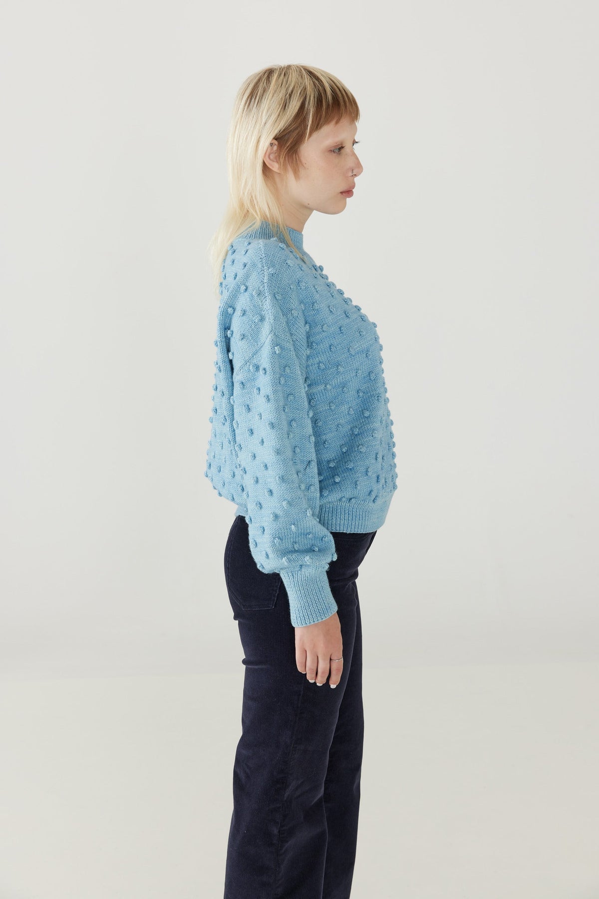 Adult Popcorn Sweater - Faded Denim+Model is 5&#39;7&quot; | 34&quot; Bust | 26.5&quot; Waist | 36.25&quot; Hips | size 4, wearing a size Small