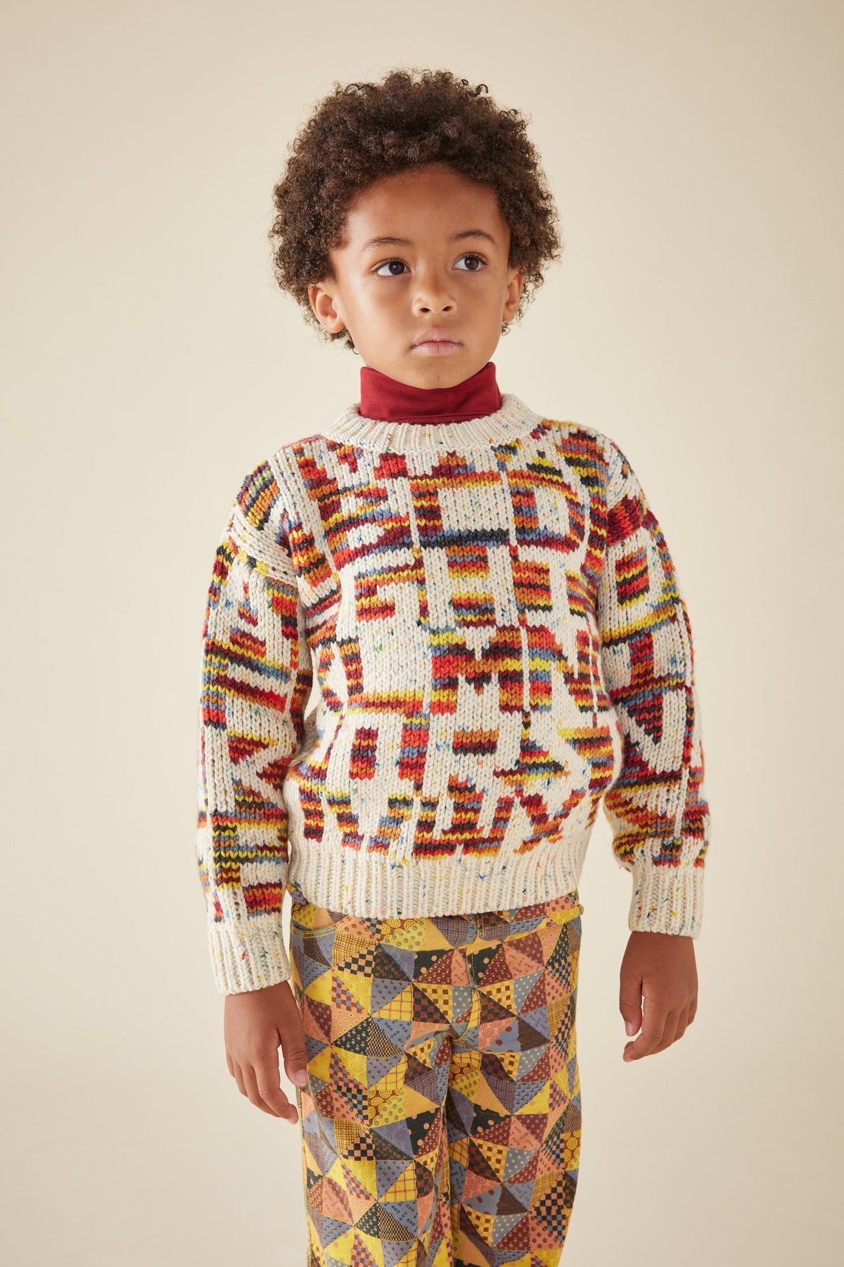 Alphabet Intarsia Sweater - Prime Confetti+Model is 45 inches tall, 46lbs, wearing a size 6-7y
