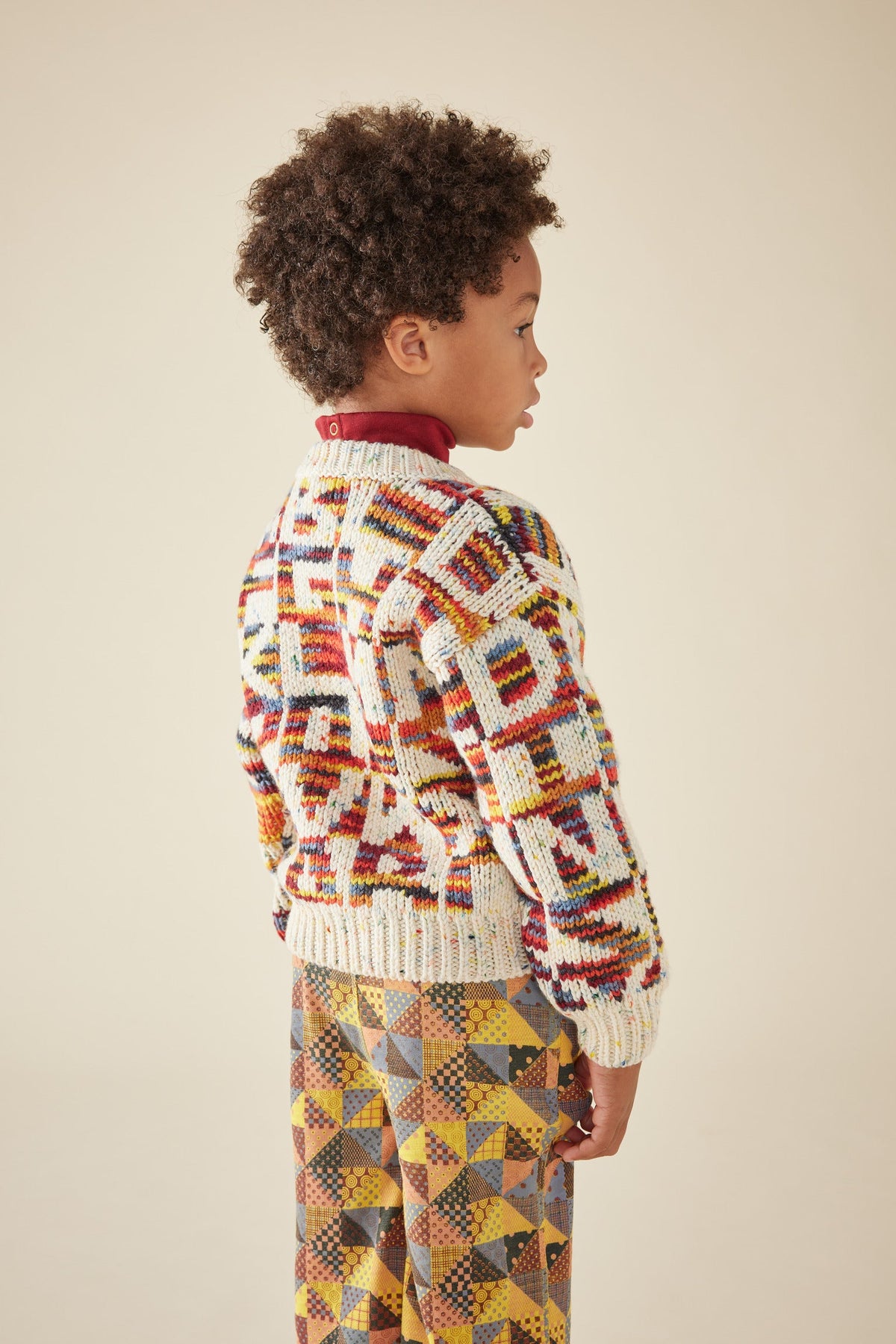 Alphabet Intarsia Sweater - Prime Confetti+Model is 45 inches tall, 46lbs, wearing a size 6-7y