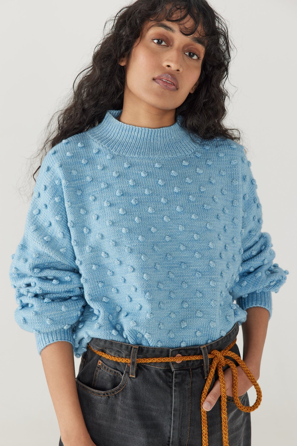 Adult Popcorn Sweater - Faded Denim+Model is 5&#39;9&quot; | 31&quot; Bust | 24&quot; Waist | 34&quot; Hips | size 2, wearing a size Small