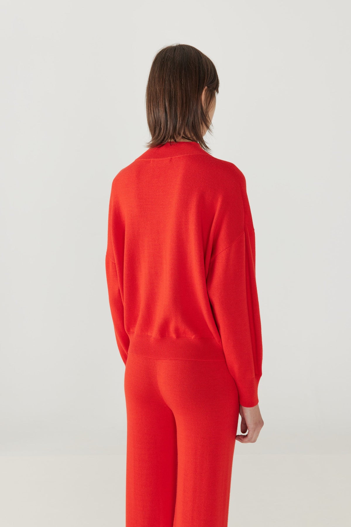 Adult Merino Mock Neck Pullover - Red Flame+Model is 6&#39;&quot; | 32&quot; Bust | 25&quot; Waist | 36.75&quot; Hips | size 2, wearing a size Small