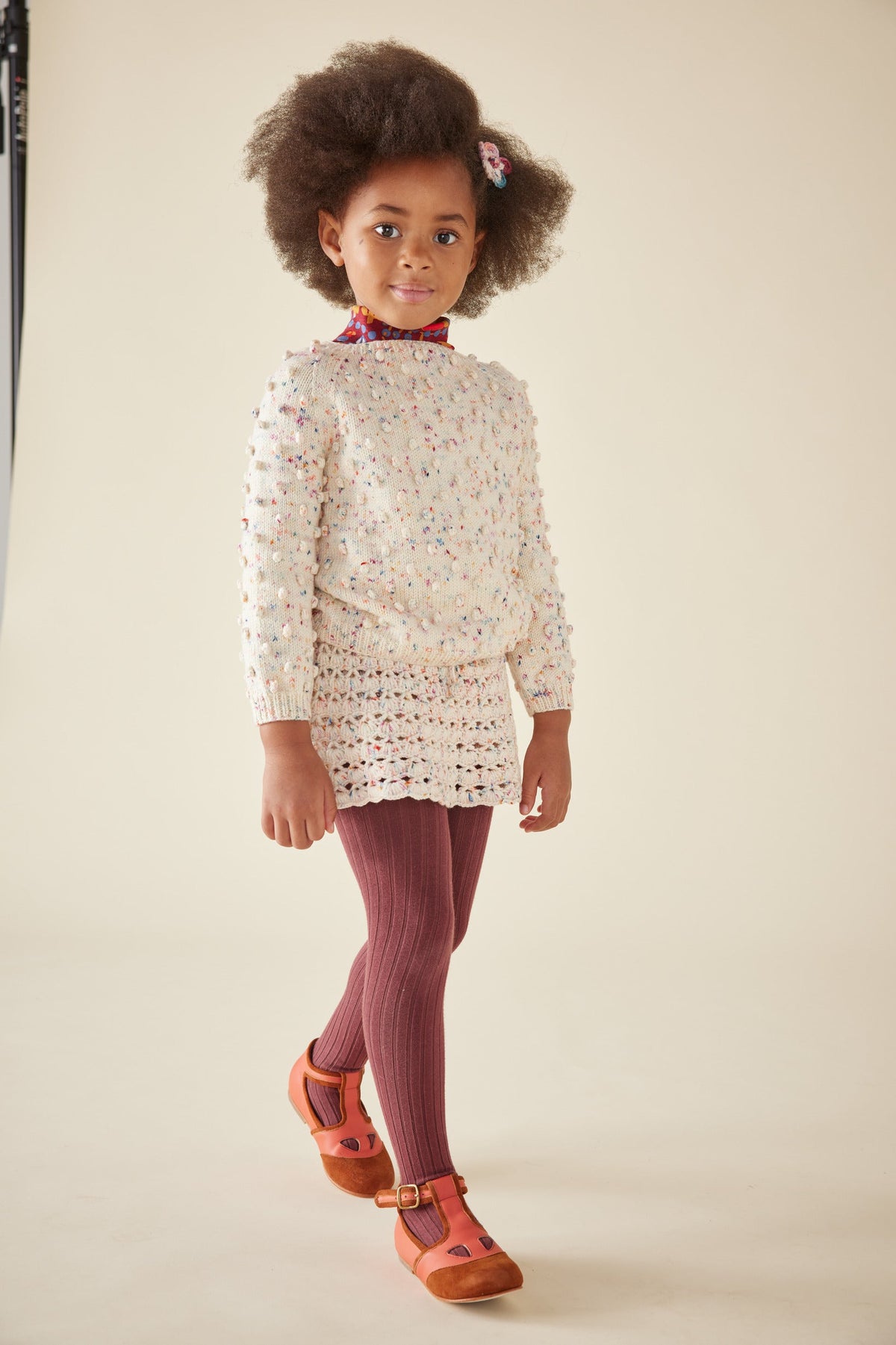 Popcorn Sweater - Lolipop Confetti+Model is 44.5 inches tall, 44lbs, wearing a size 4-5y