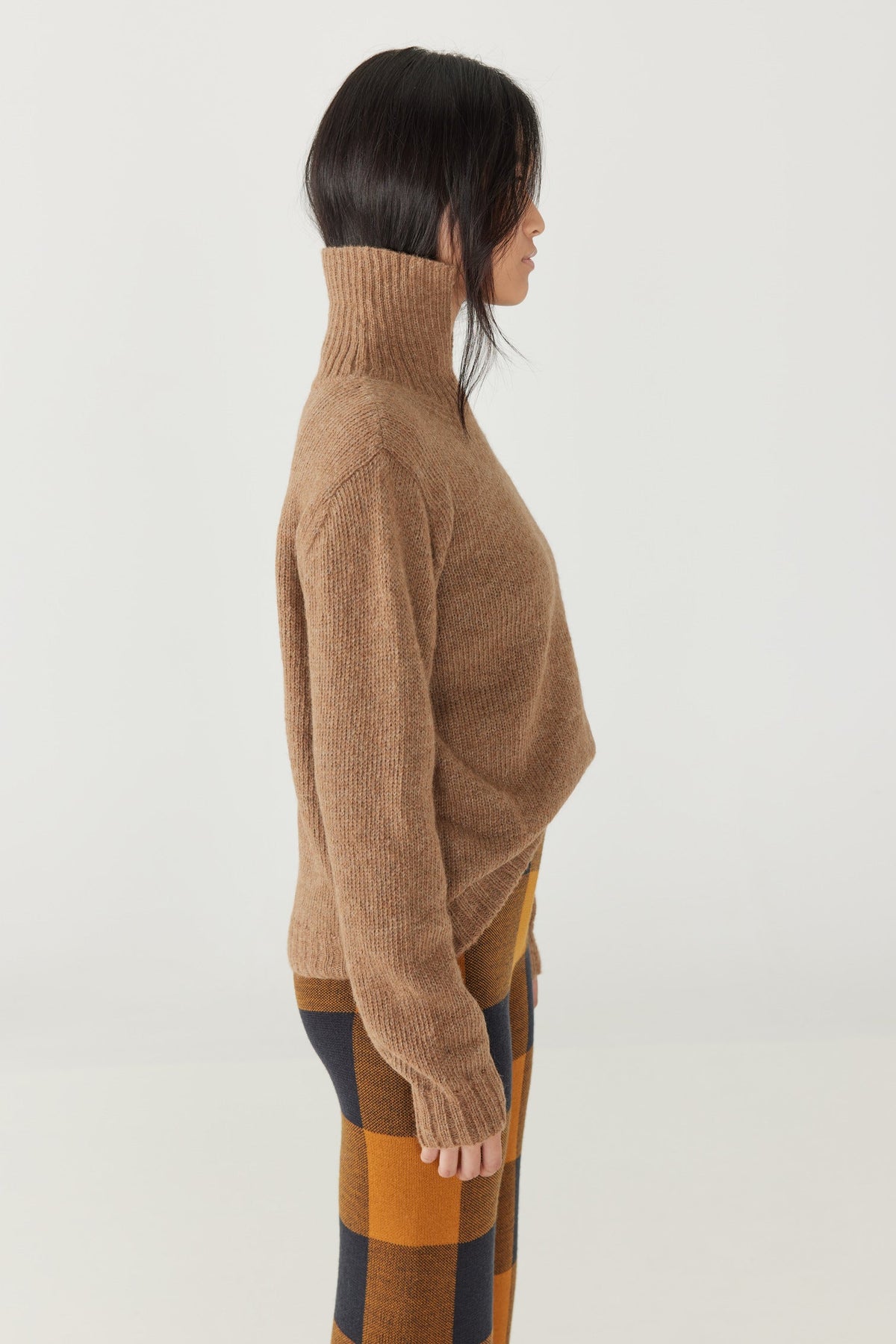 Adult Natural Alpaca O&#39;Rourke Sweater - Camel+Model is 5&#39;8&quot; | 31.5&quot; Bust | 25&quot; Waist | 36&quot; Hips | size 2, wearing a size Small