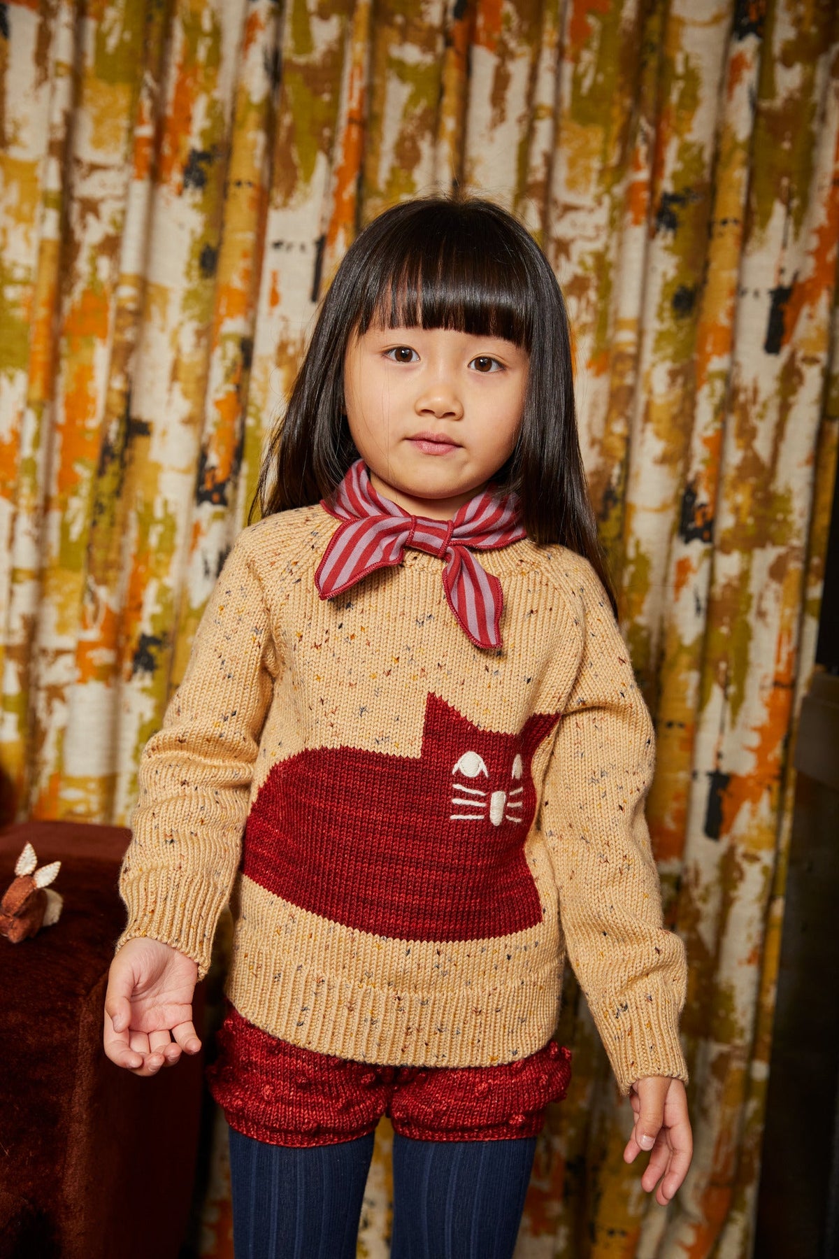 Cat Sweater - Camel Confetti+Model is 43 inches tall, 38lbs, wearing a size 4-5y