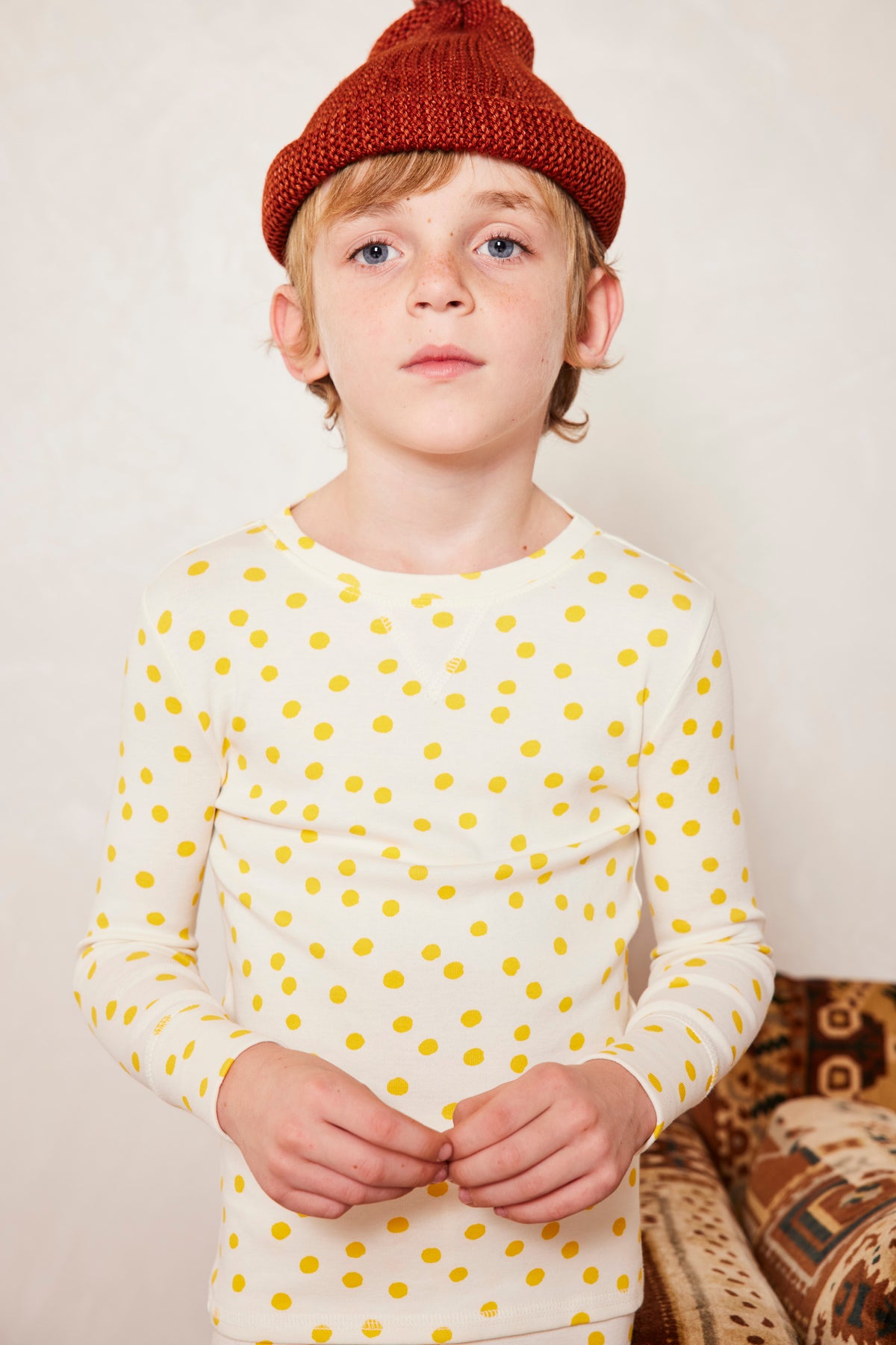Pajama Set - Winter Cream Polka Dot+Model is 47 inches tall, 45lbs, wearing a size 6-7y