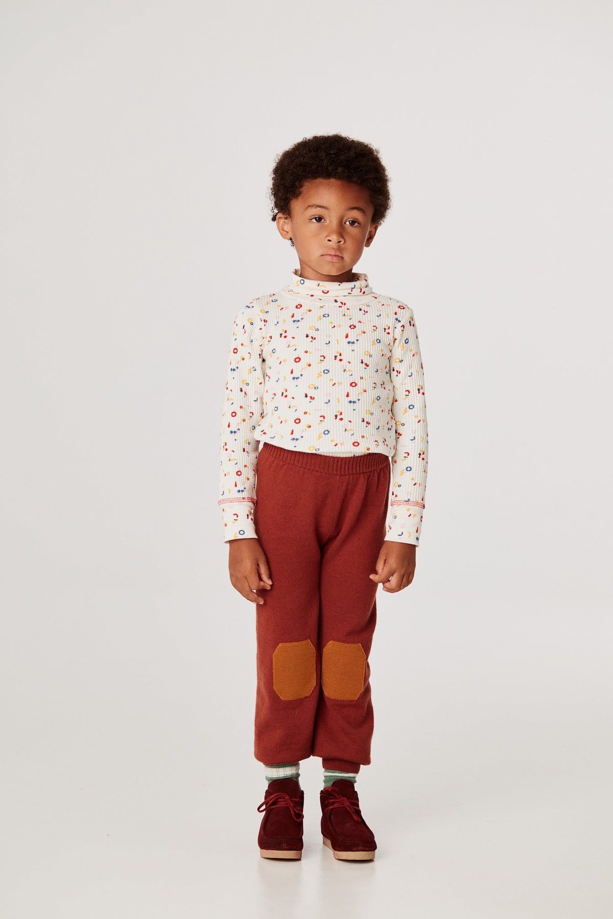 New Merino Jogger - Henna+Model is 45 inches tall, 46lbs, wearing a size 4-5y