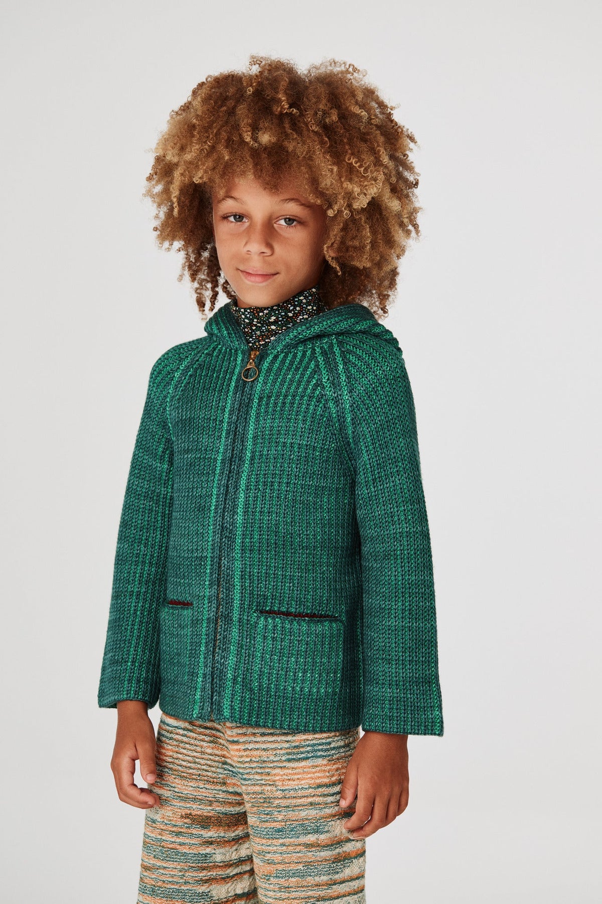 North Wind Jacket - Peacock+Model is 50 inches tall, 50lbs, wearing a size 7-8y