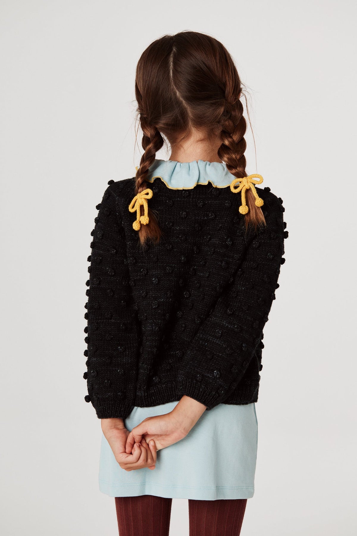 Popcorn Cardigan - Carbon+Model is 48 inches tall, 47lbs, wearing a size 4-5y