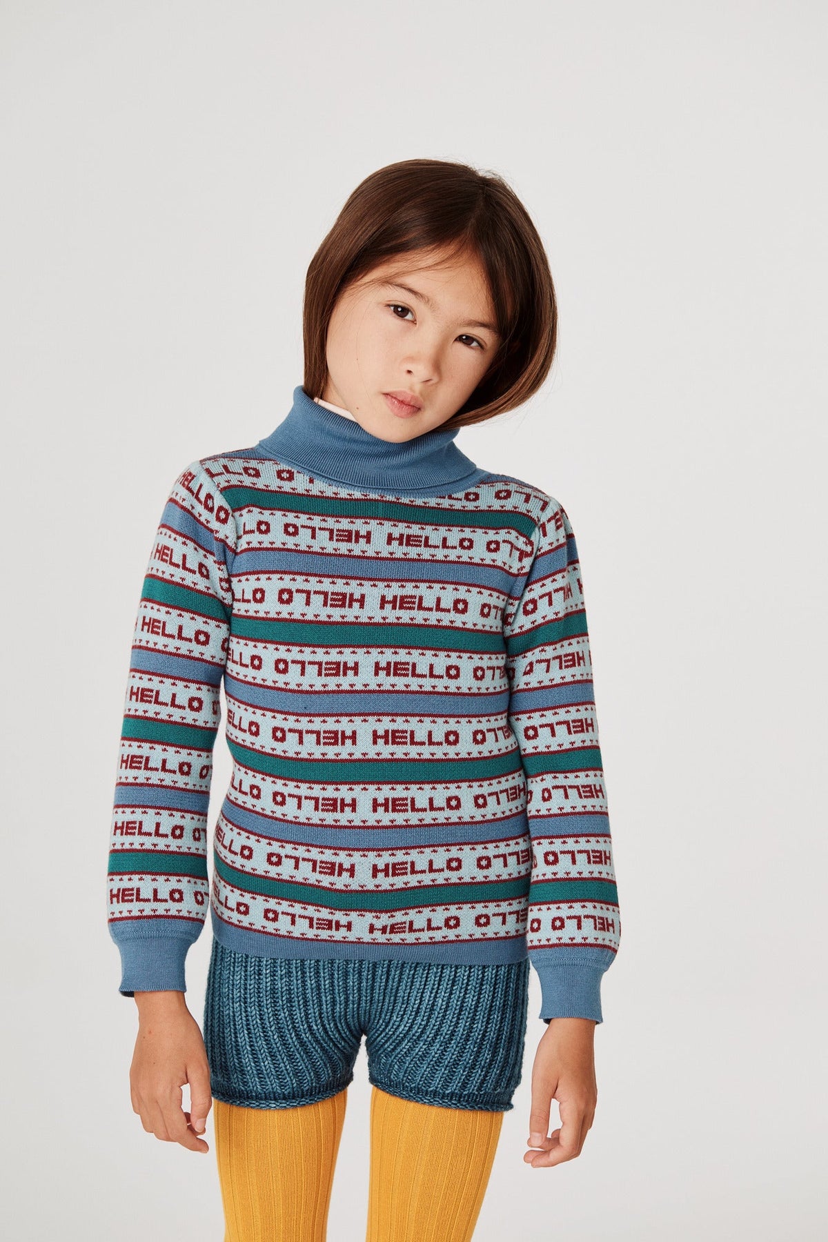 Word Stripe Turtleneck - Dusk+Model is 48 inches tall, 47lbs, wearing a size 4-5y